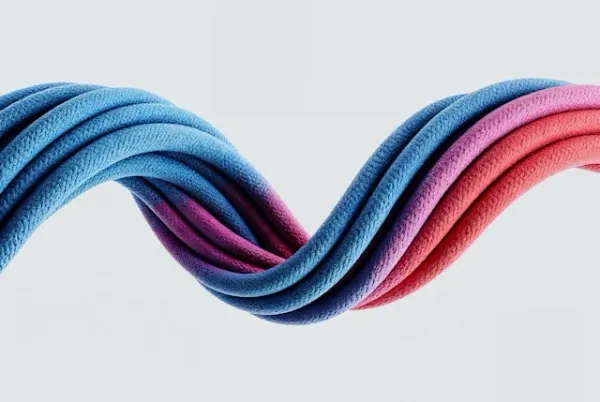 Torsade de textiles aux couleurs vibrantes bleu, violet et rose, composition design contemporaine sur fond clair